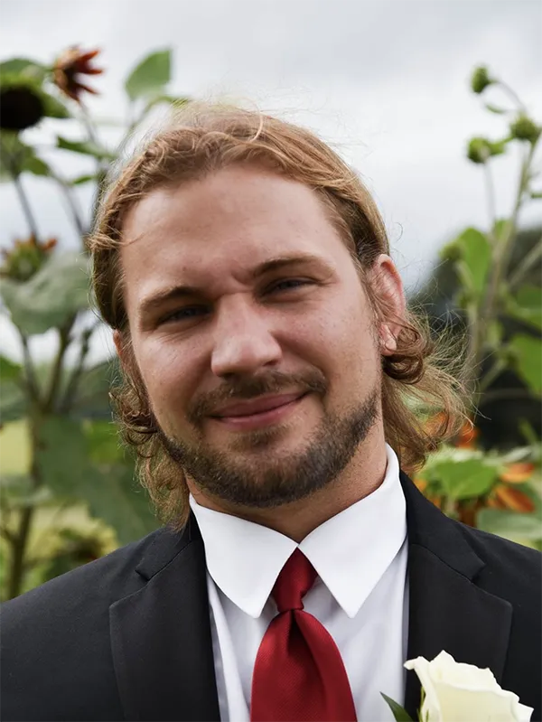 Mike Billau director of online ministries at Satellite Gaming wearing a tux and a boutonniere